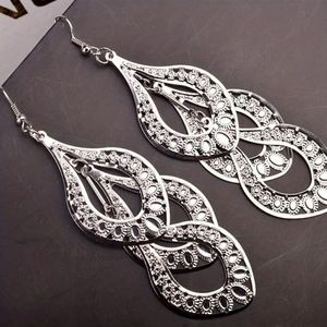 Multi layer dangle earrings. Silver tone